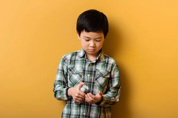 Cute Asian Boy Holding Bottle Antiseptic Yellow Self Isolation — Stock Photo, Image
