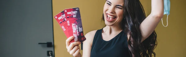 Panoramic Shot Excited Girl Holding Medical Mask Night Party Tickets — Stock Photo, Image