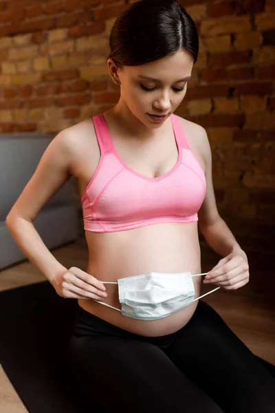 Pregnant Woman Sportswear Holding Medical Mask Belly — Stock Photo, Image