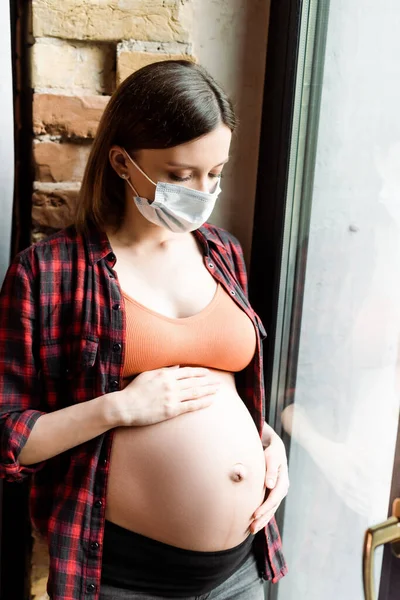 Pregnant Woman Medical Mask Touching Belly Window — Stock Photo, Image