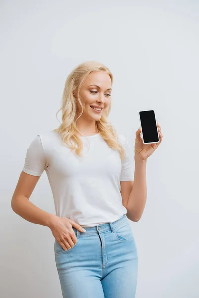 Smiling Woman Holding Hand Pocket While Looking Smartphone Blank Screen — Stock Photo, Image