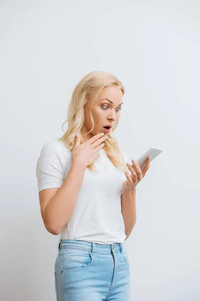 Shocked Girl Touching Chin While Having Video Call Smartphone Isolated — Stock Photo, Image