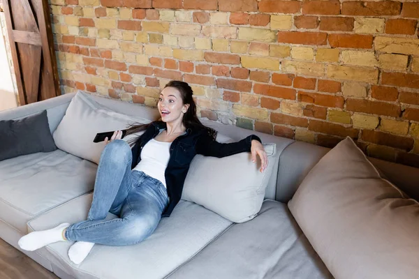 Excited Woman Sitting Sofa Watching Movie — Stock Photo, Image