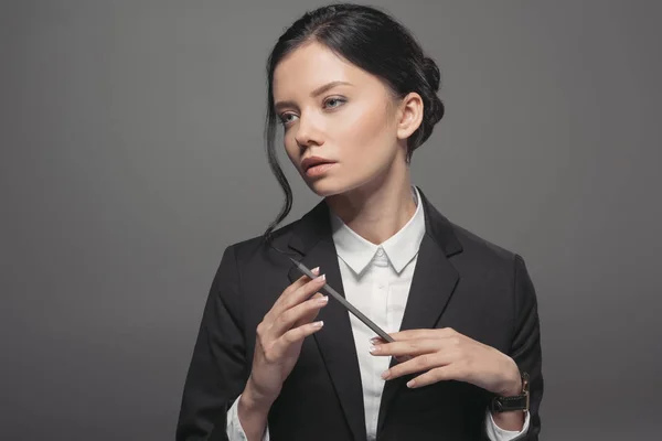 Businesswoman holding pencil — Stock Photo