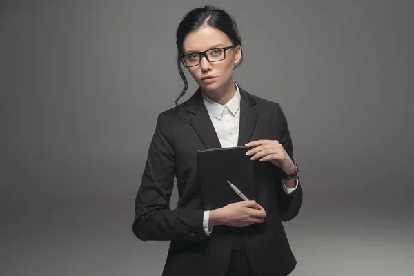 Businesswoman holding diary — Stock Photo