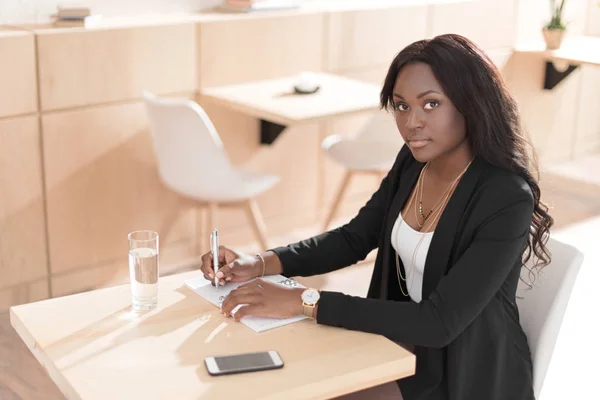 African american woman in cafe — Stock Photo