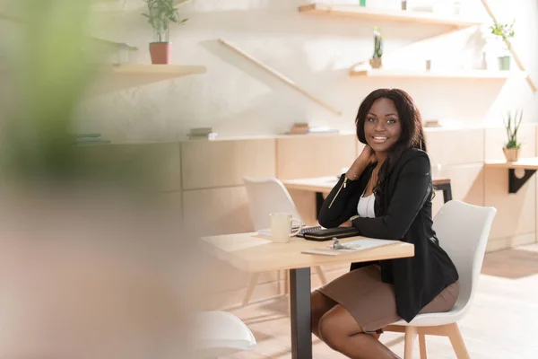 African american woman in cafe — Stock Photo