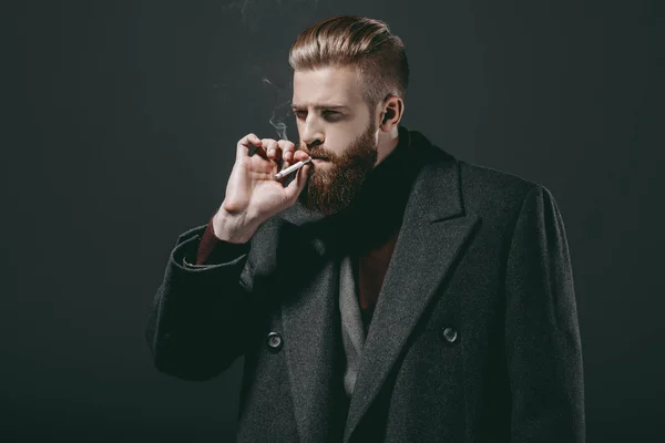 Stylish man smoking cigarette — Stock Photo