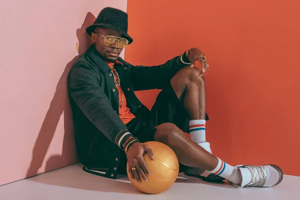 Stylish man with golden ball — Stock Photo