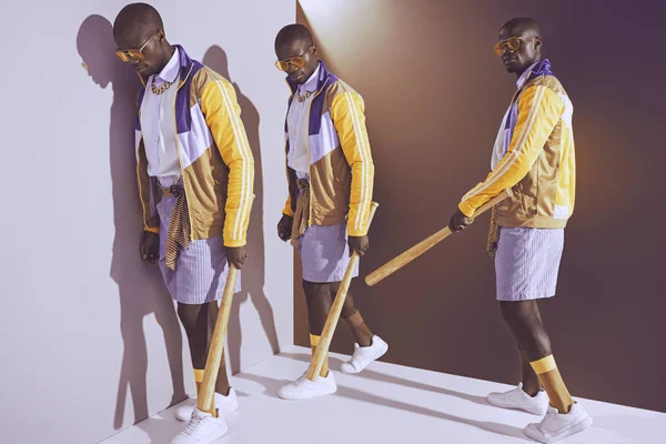 Élégant homme afro-américain avec chauve-souris — Photo de stock