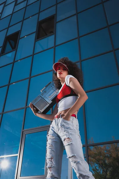 Beautiful woman with boombox — Stock Photo