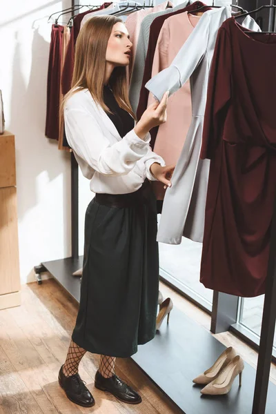 Beautiful girl in boutique — Stock Photo