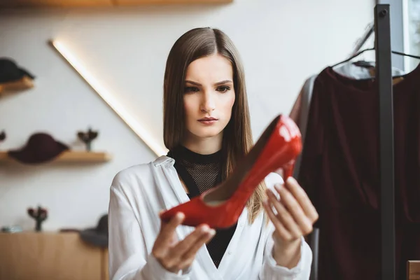 Woman choosing elegant heels — Stock Photo