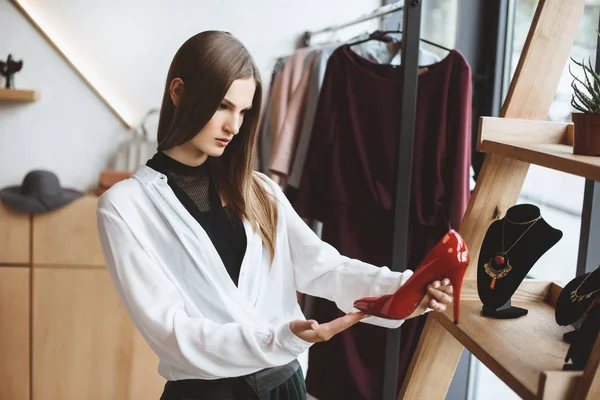 Woman choosing elegant heels — Stock Photo