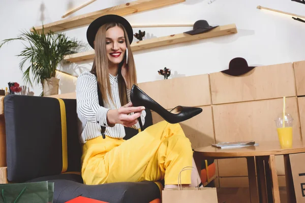 Beautiful girl choosing heels — Stock Photo