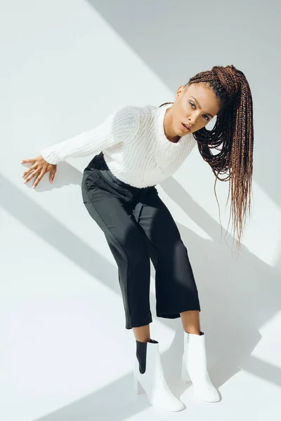 African american girl in white sweater — Stock Photo