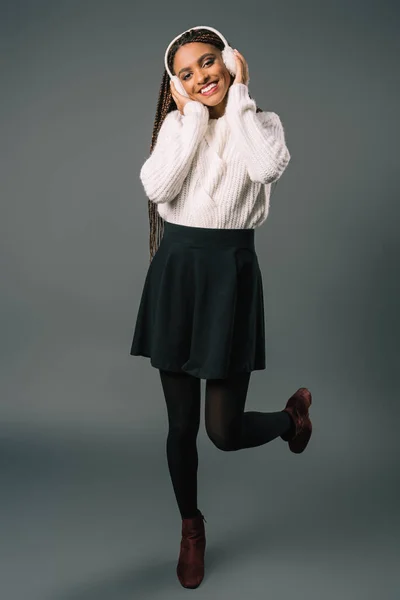 African american girl in winter earmuffs — Stock Photo