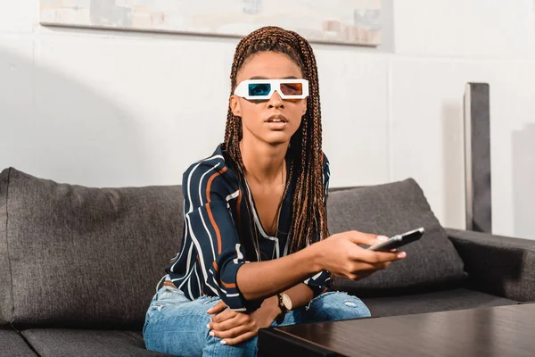 Woman watching tv in 3d goggles — Stock Photo