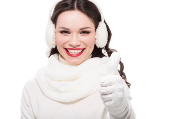 Woman in earmuffs showing thumb up — Stock Photo