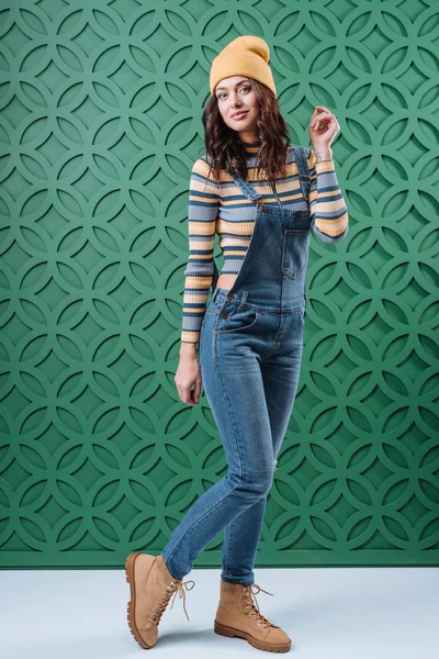 Woman posing in pullover, hat and overalls — Stock Photo