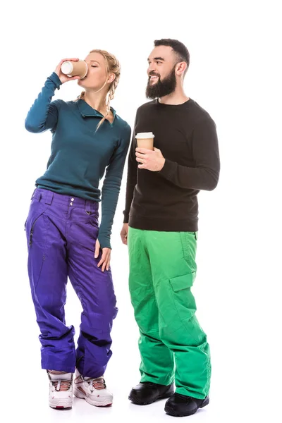 Couple of snowboarders with coffee to go — Stock Photo