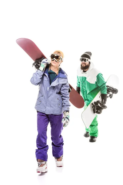 Couple in snowboarding costumes with snowboards — Stock Photo