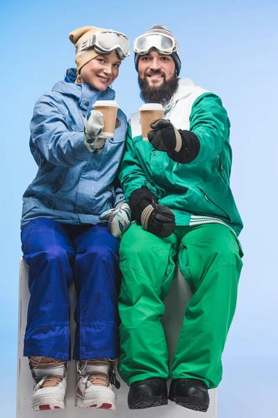 Snowboarders with coffee to go — Stock Photo