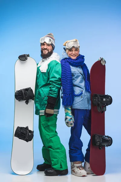 Happy couple wit snowboards — Stock Photo