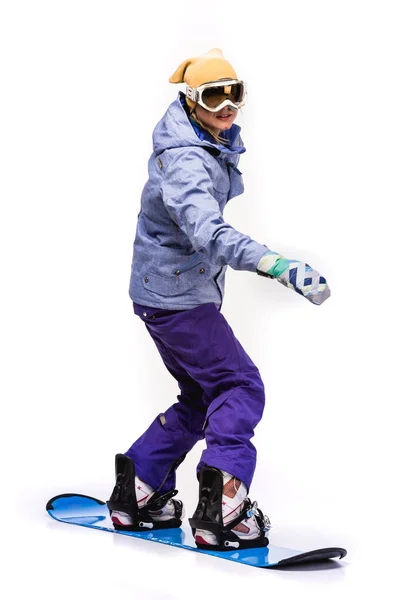 Mujer de pie sobre snowboard - foto de stock