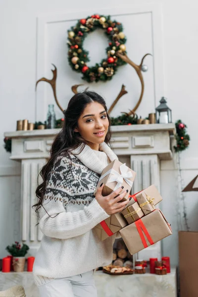 Woman with christmas gifts — Stock Photo