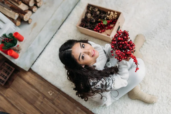 Woman with natural christmas decor — Stock Photo