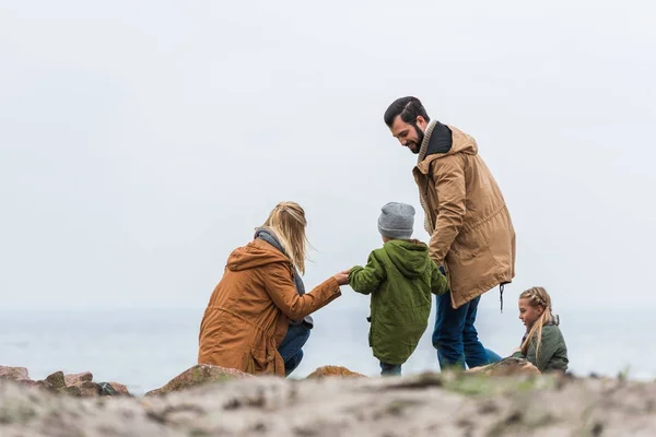 Family spending time on seashore — Stock Photo