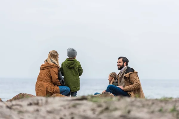 Family spending time on seashore — Stock Photo