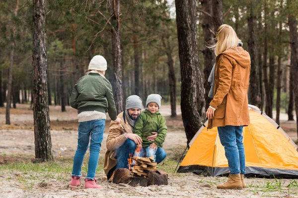 Family making campfire — Stock Photo