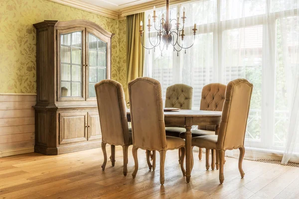 Table and chairs in classic interior — Stock Photo
