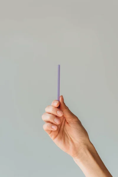 Woman holding drinking straw in hand — Stock Photo