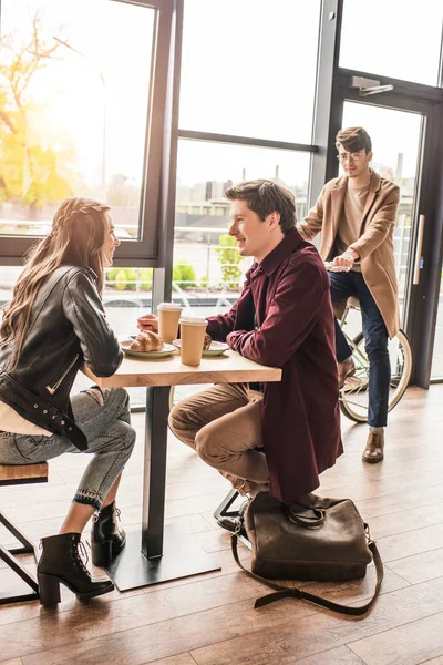 Couple sitting at table in cafe — Stock Photo