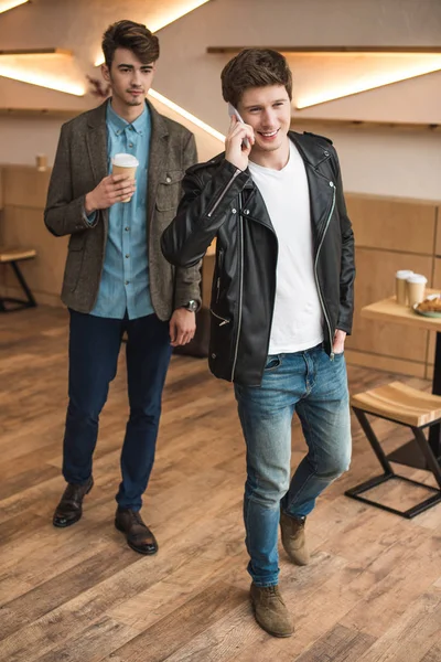 Men leaving cafe — Stock Photo