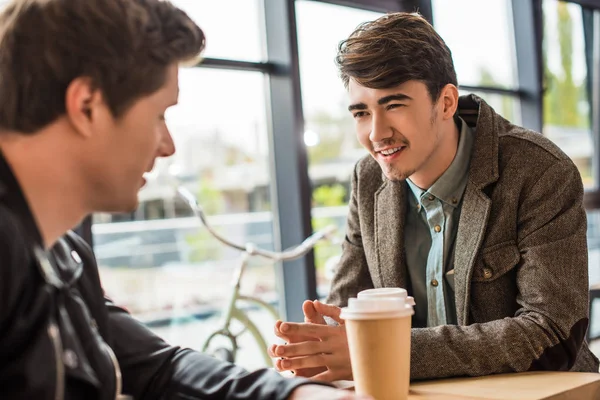 Men sitting in cafe — Stock Photo