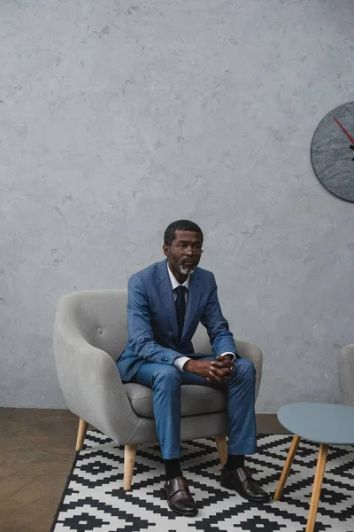 Middle aged businessman in waiting room — Stock Photo