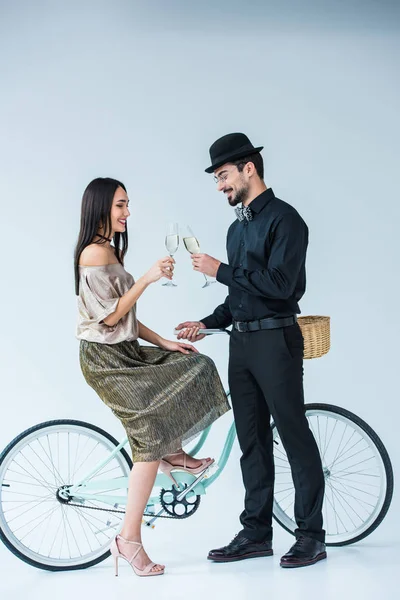 Multicultural couple clinking glasses of champagne — Stock Photo