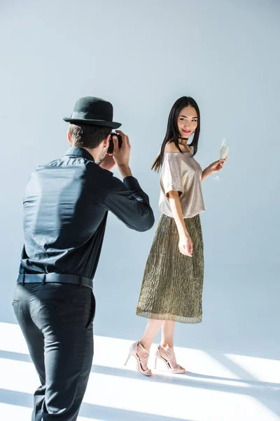 Man taking picture of asian girlfriend — Stock Photo