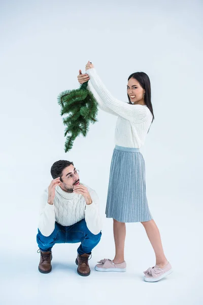 Multicultural couple with christmas tree — Stock Photo