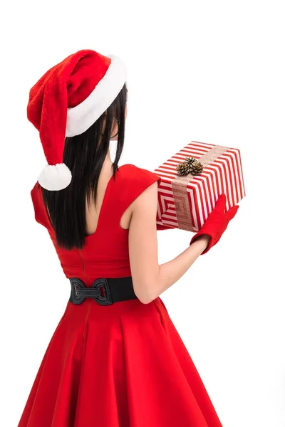 Woman in santa costume with gift — Stock Photo