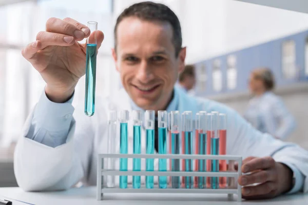 Scientist working with test tubes — Stock Photo