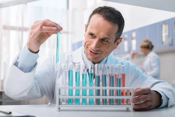 Scientist holding test tube — Stock Photo