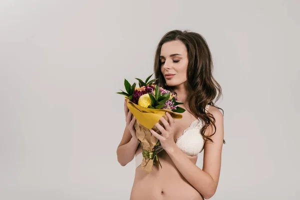 Girl in lingerie holding flowers — Stock Photo