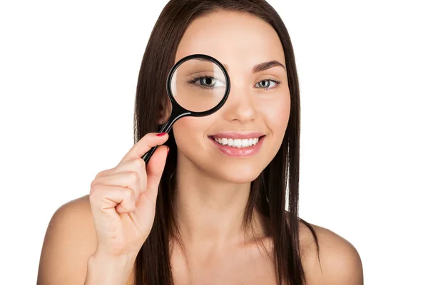 Woman with magnifying glass — Stock Photo