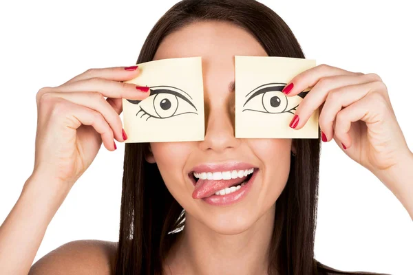 Femme couvrant les yeux avec des autocollants — Stock Photo