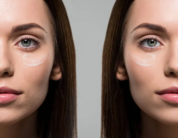 Mujer aplicando crema facial - foto de stock